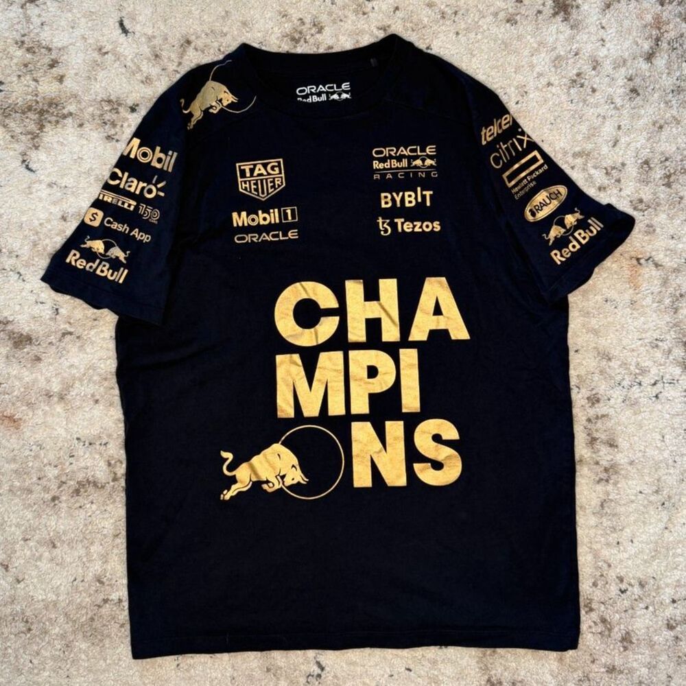 Title: Oracle Red Bull Racing "Champions" Gold Foil Tee